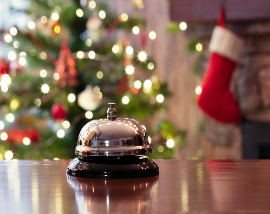bell at front desk of christmasy hotel