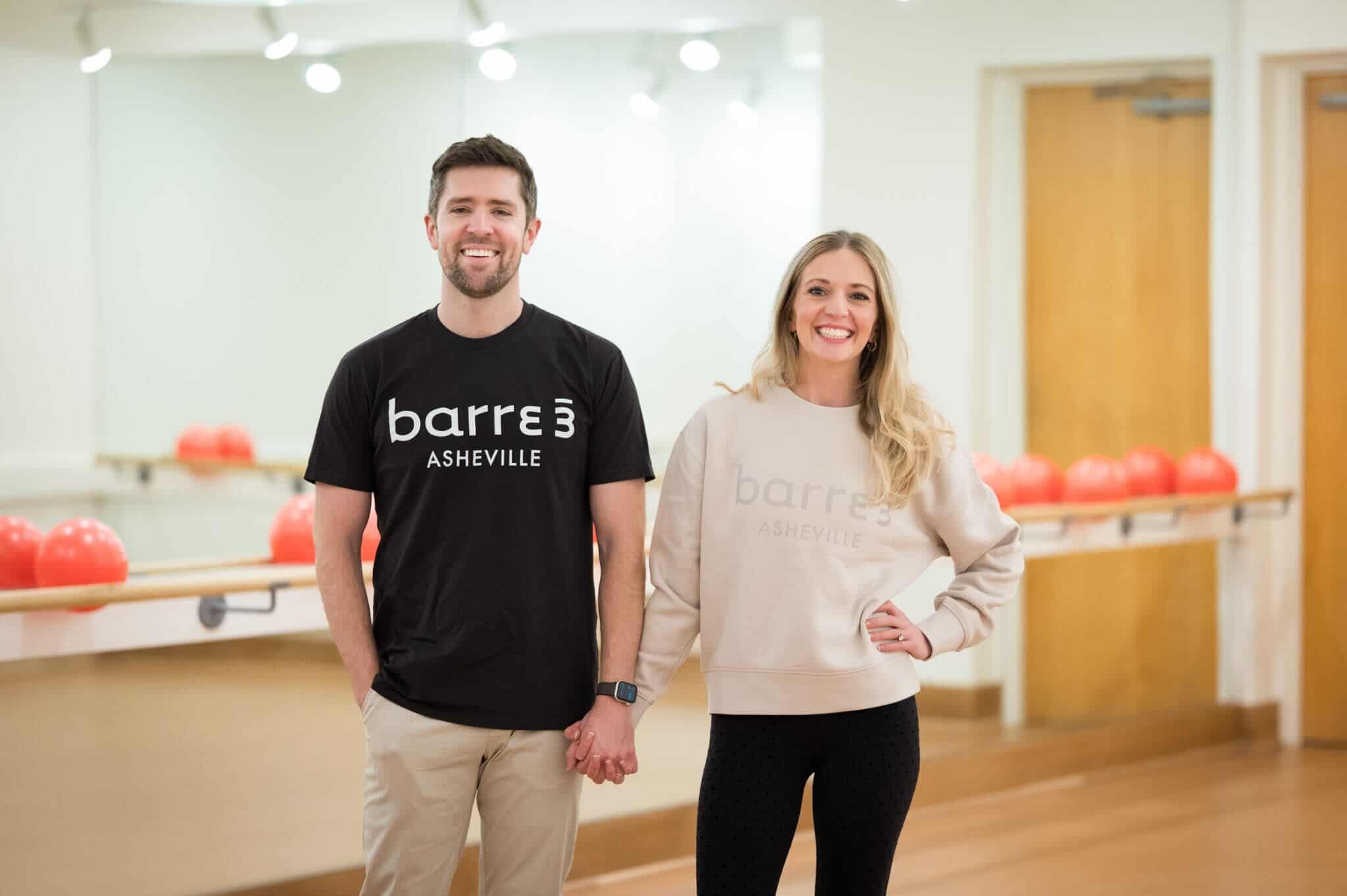 barre3 Asheville owners stand in studio.